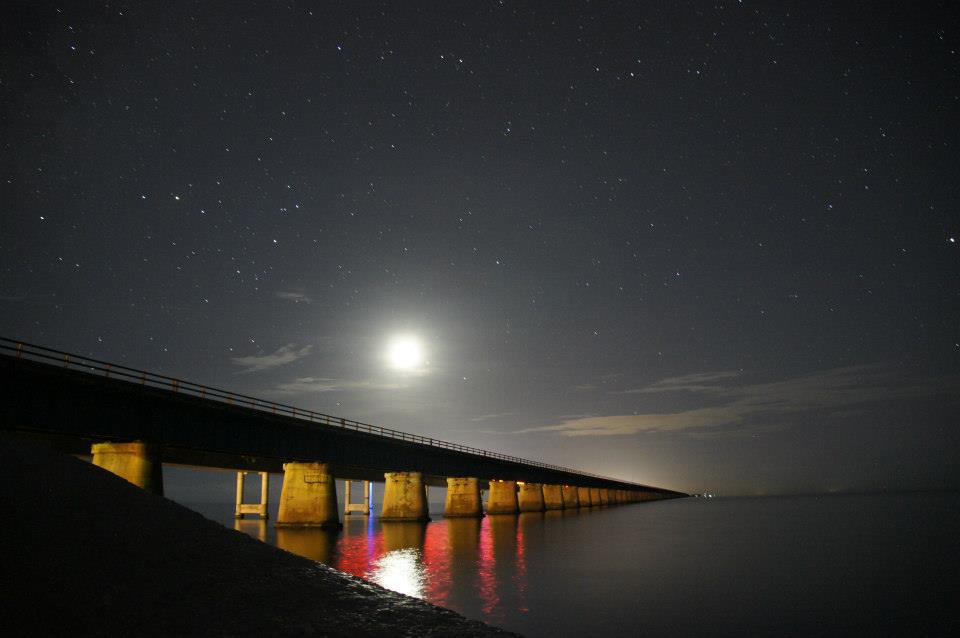 Cane Point - the moon rising over bridge photo